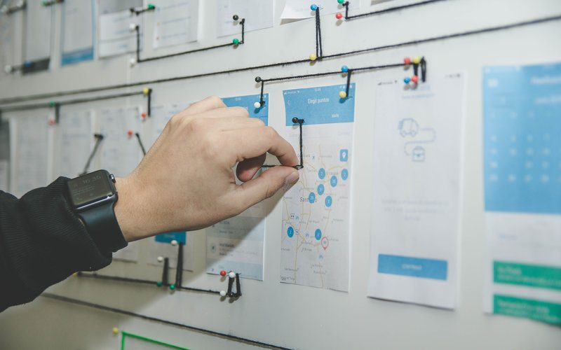 Guy pinning string on project layout
