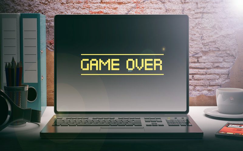 Laptop with Game Over on the screen