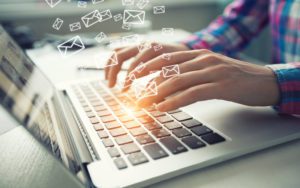 Woman typing on a laptop