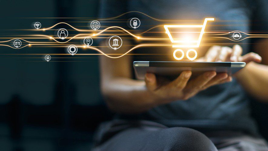 Online shopping and payment, Man using tablet with shopping cart icon, Digital marketing, Banking and finance on dark blue background.