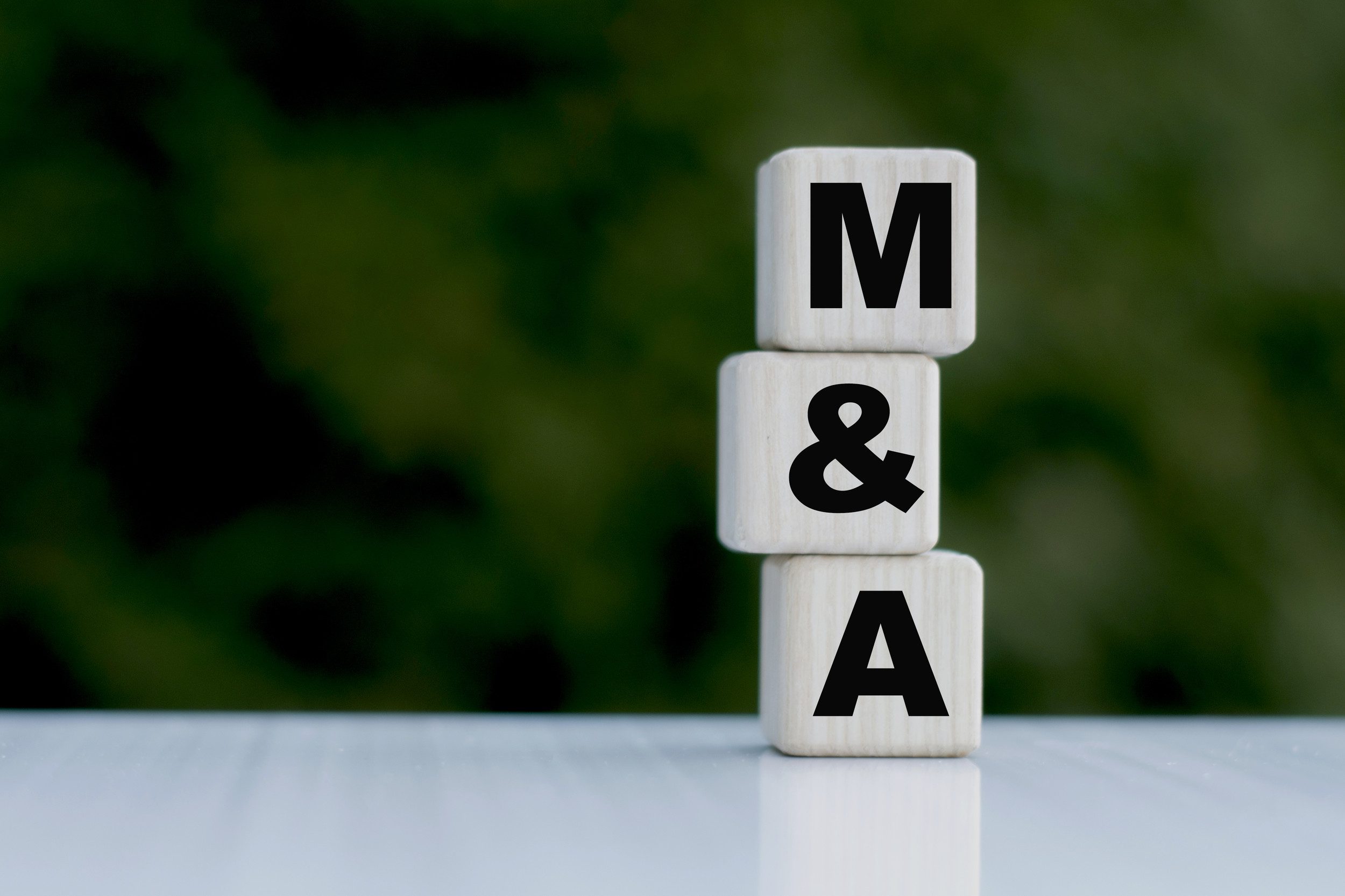 M&A on wooden blocks